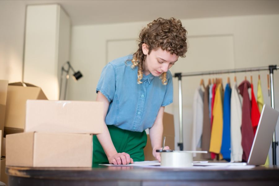 Small business owner packing customer orders