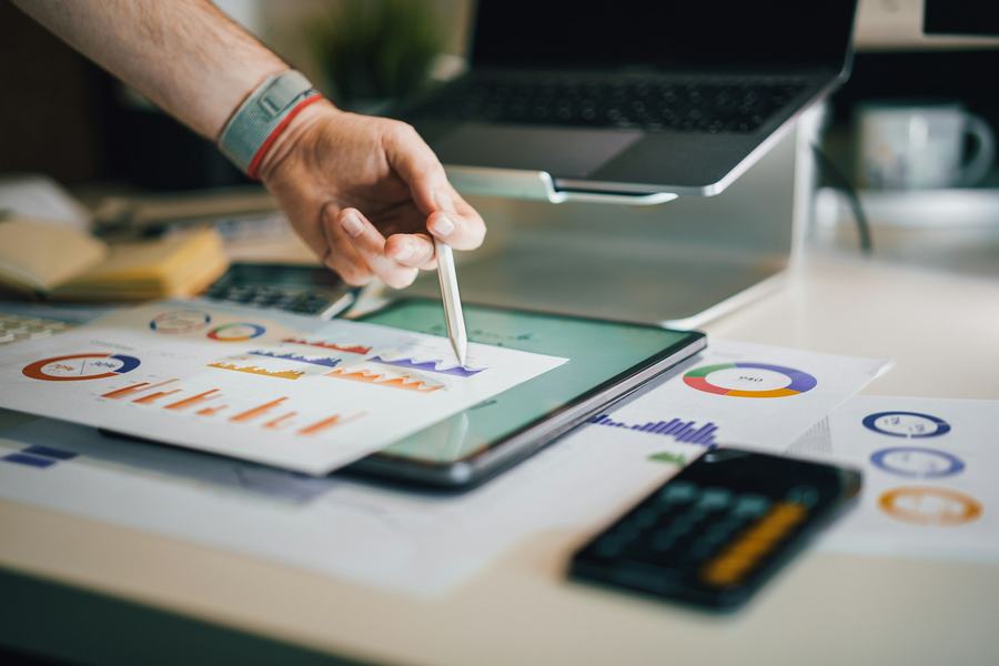 Reviewing charts in a financial report on a tablet